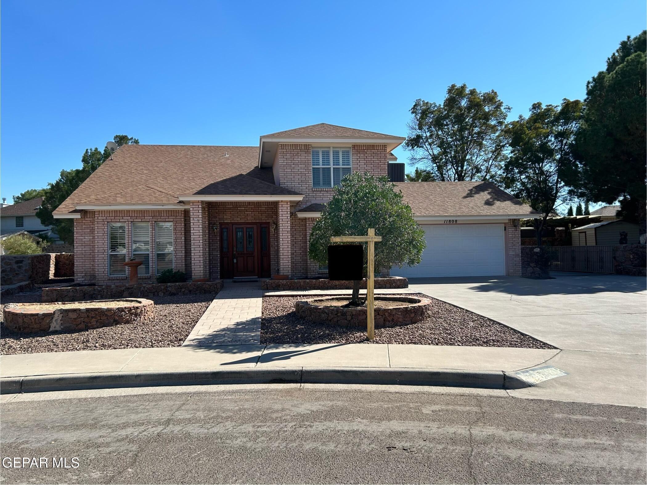 a front view of a house with garage