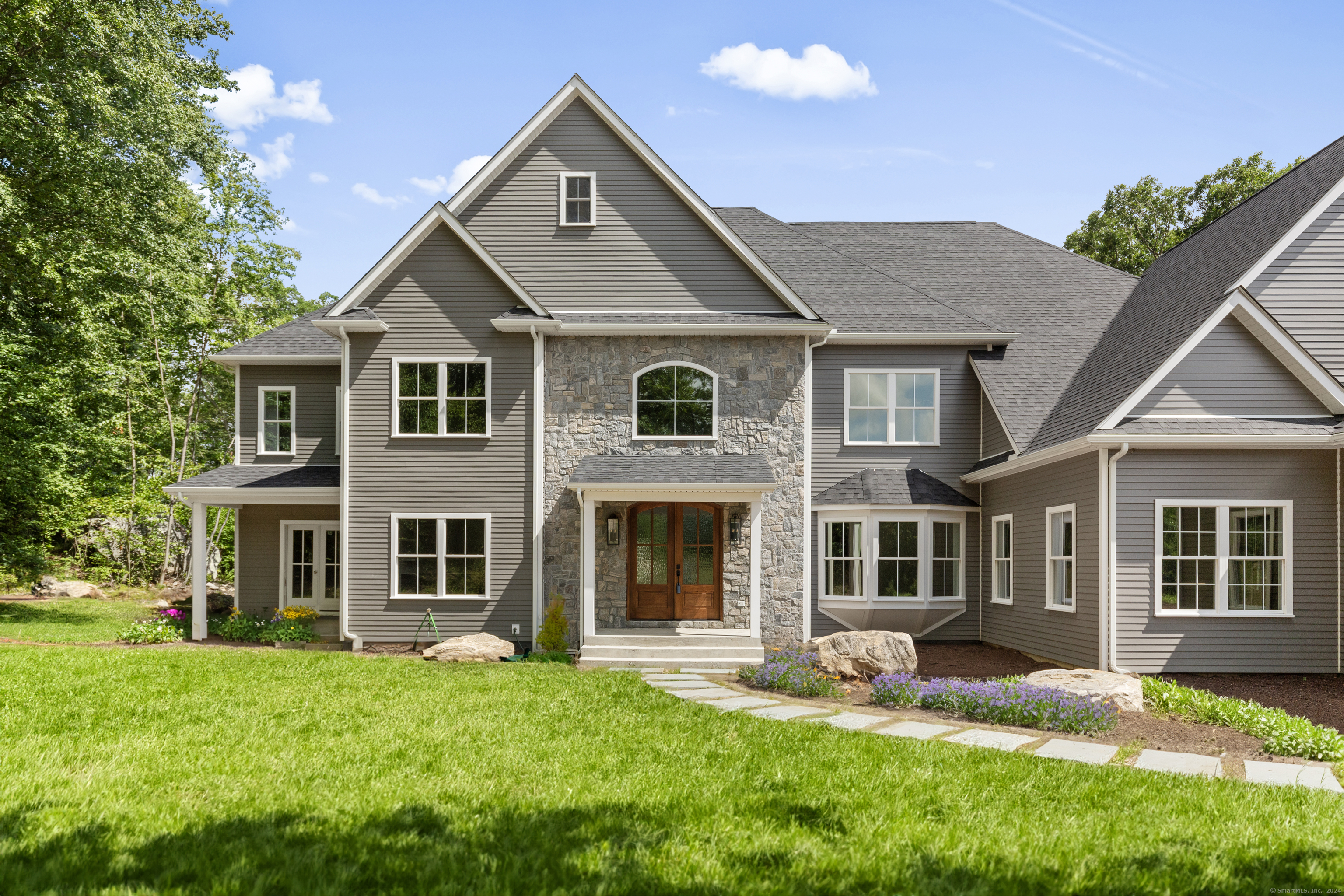 front view of a house with a yard