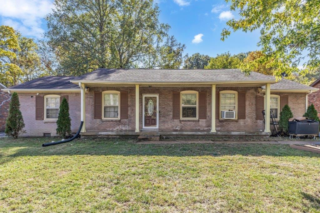 front view of a house with a yard