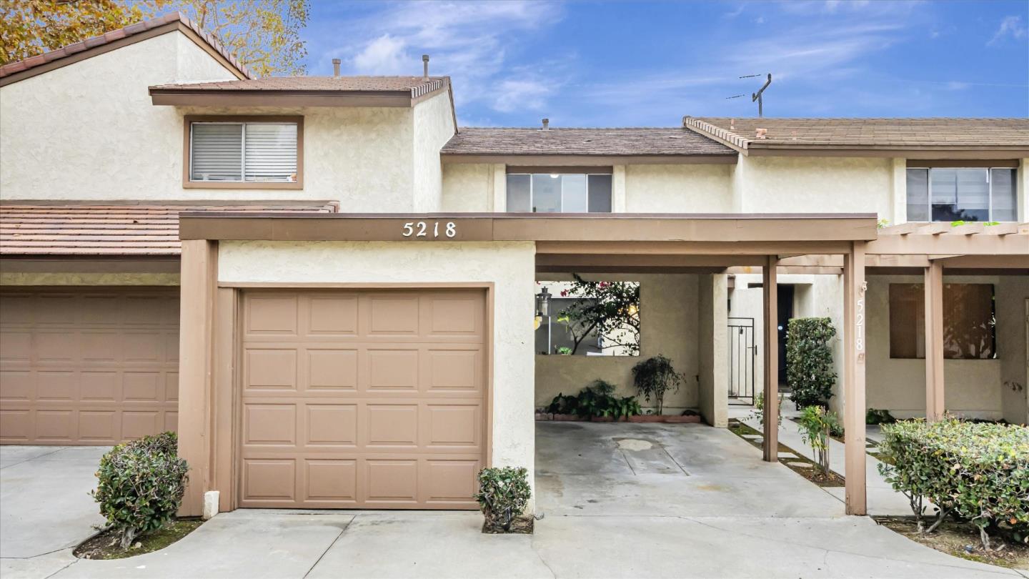 a front view of a house with a garage