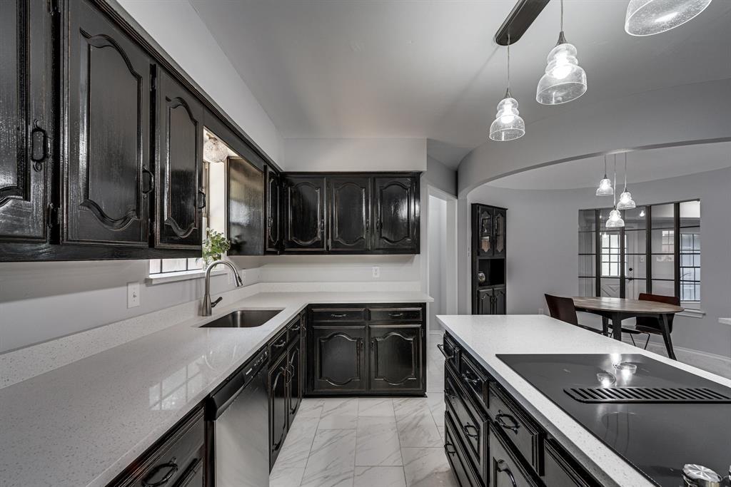 a kitchen with a sink and stove