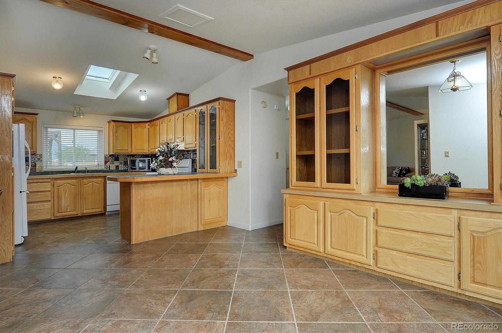 a kitchen with stainless steel appliances granite countertop a stove and a sink