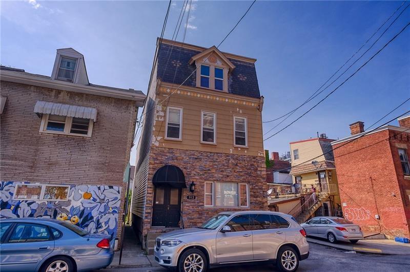 a front view of a house with parking