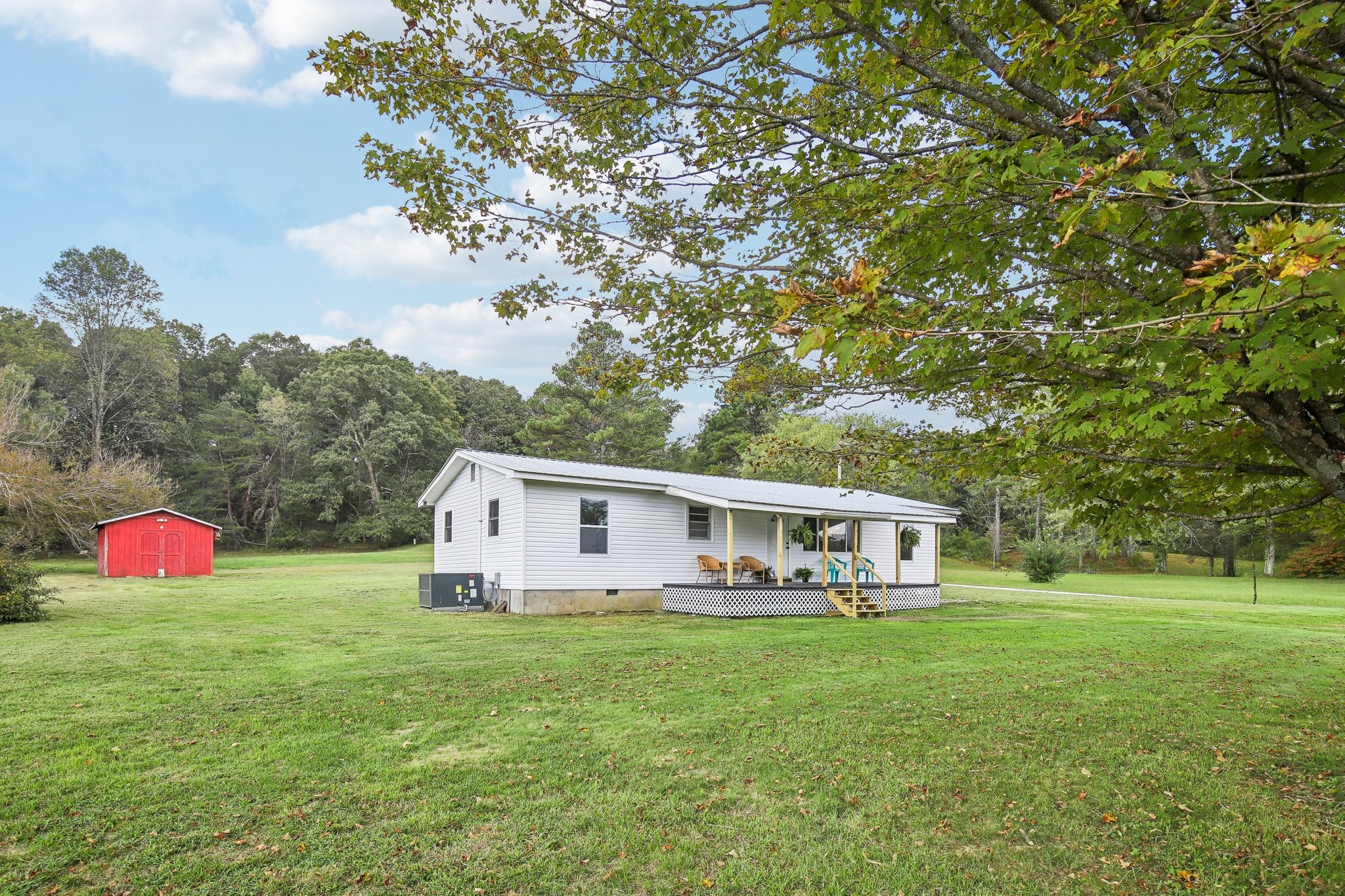 a front view of house with yard and outdoor seating