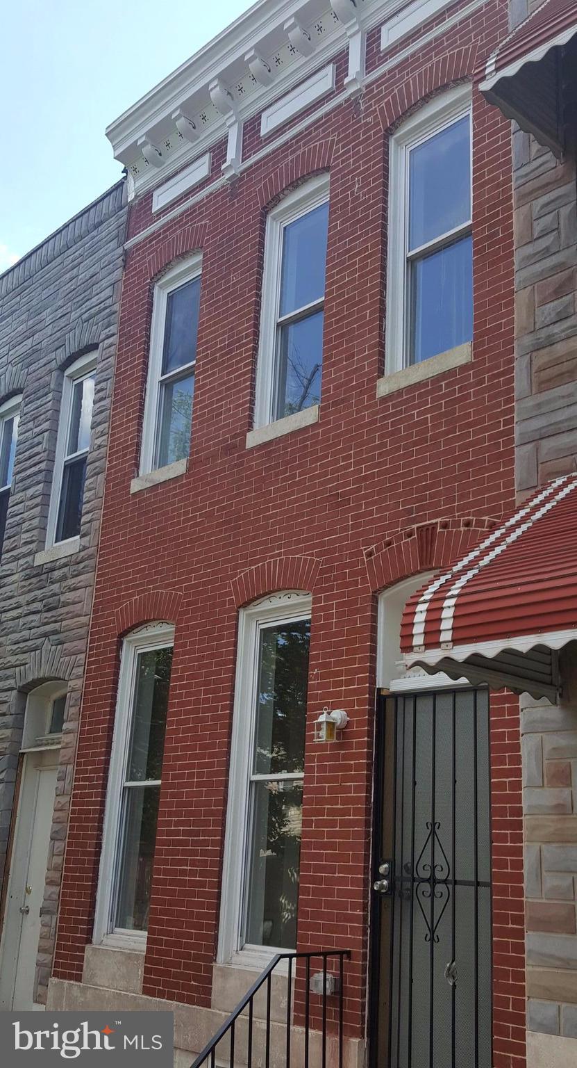 a front view of a building with glass windows