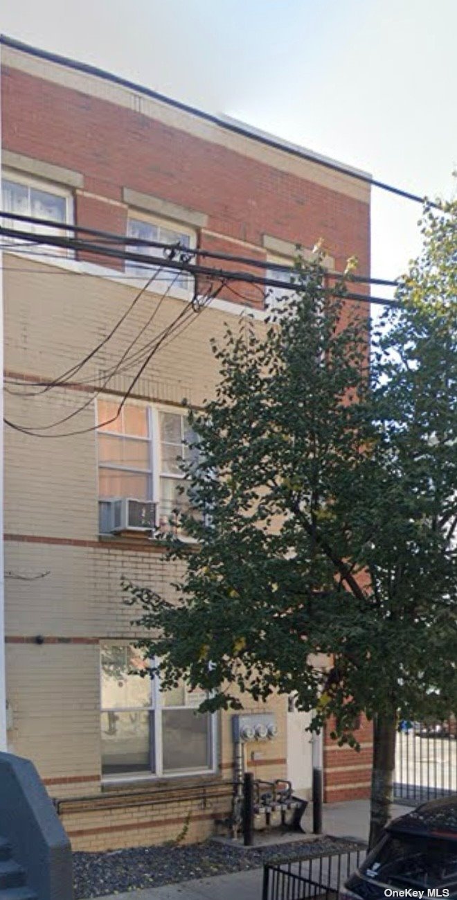 a view of a tall building from a street