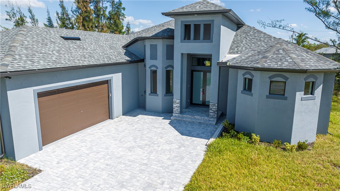 a front view of a house with a yard