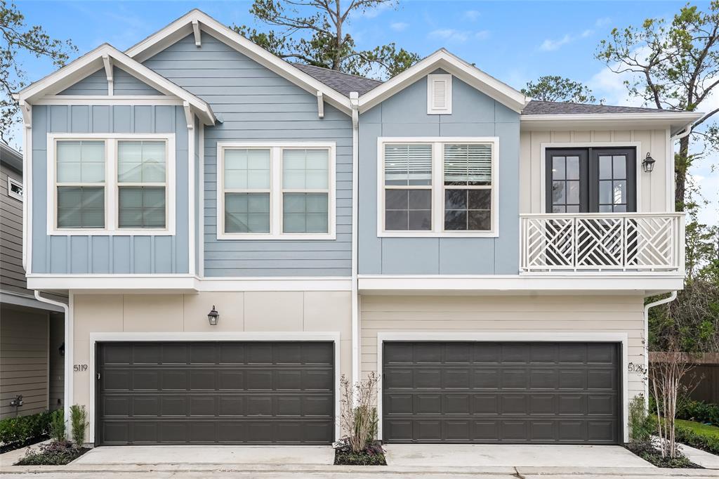 a front view of a house with garage