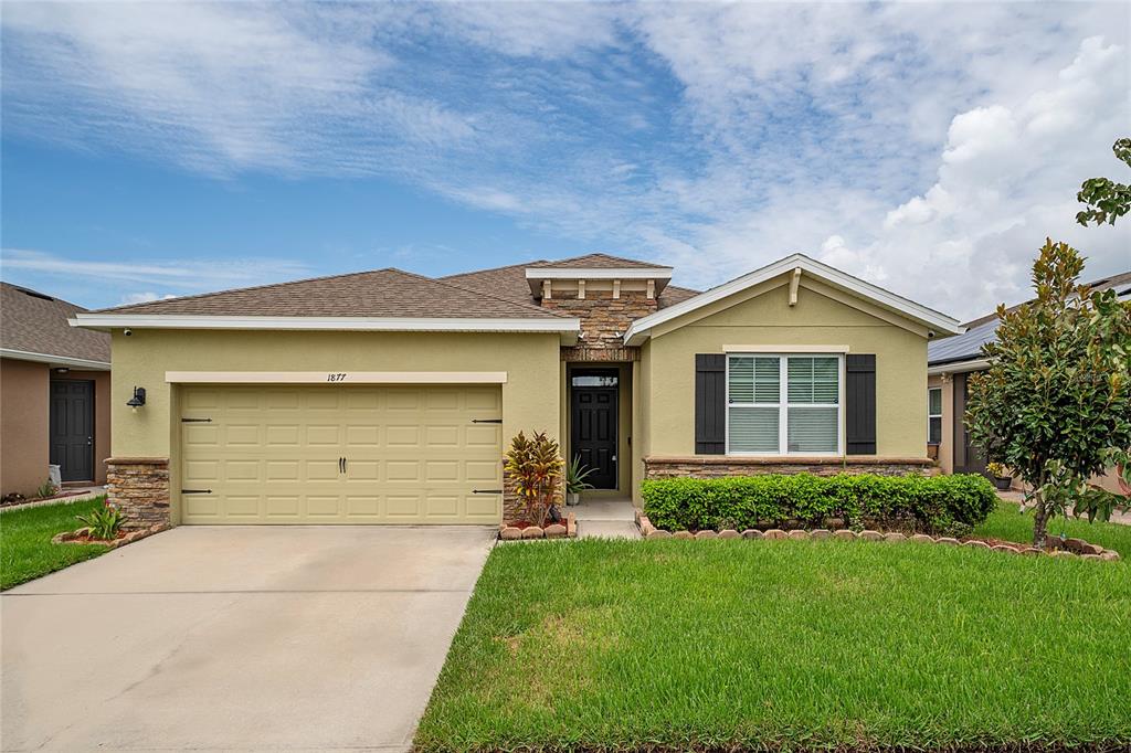 front view of a house with a yard