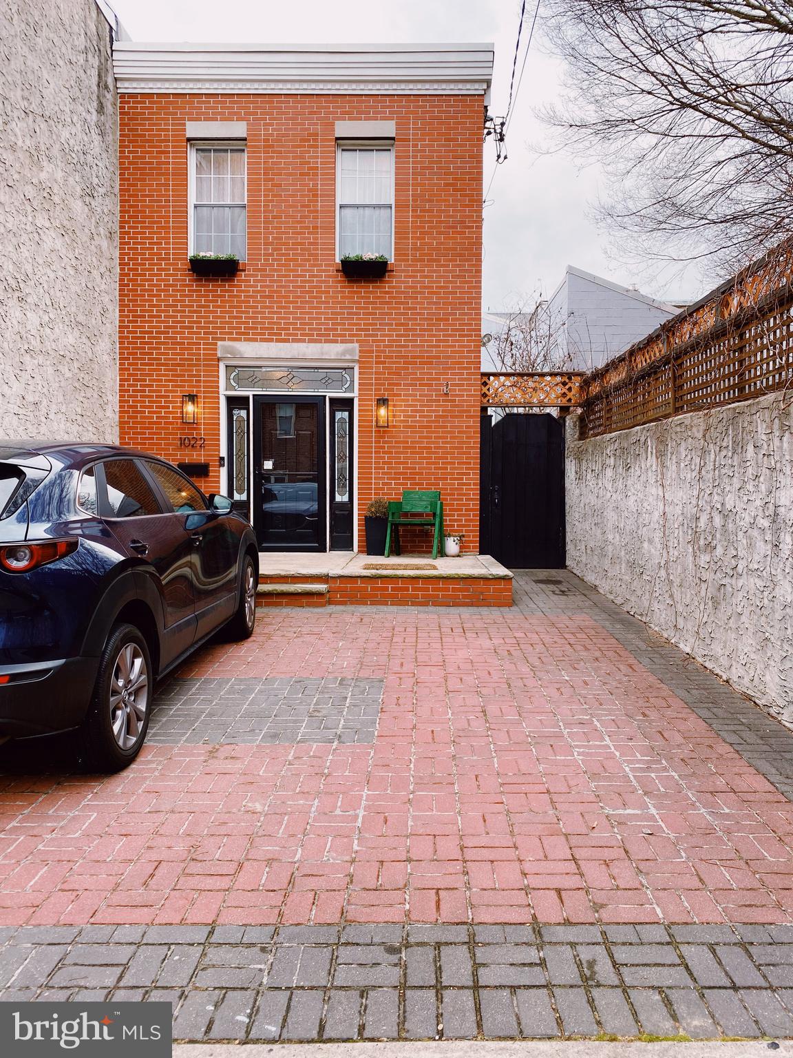 a view of a car parked in front of a building