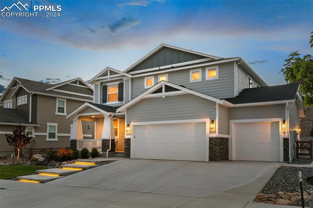 a front view of a house with garage