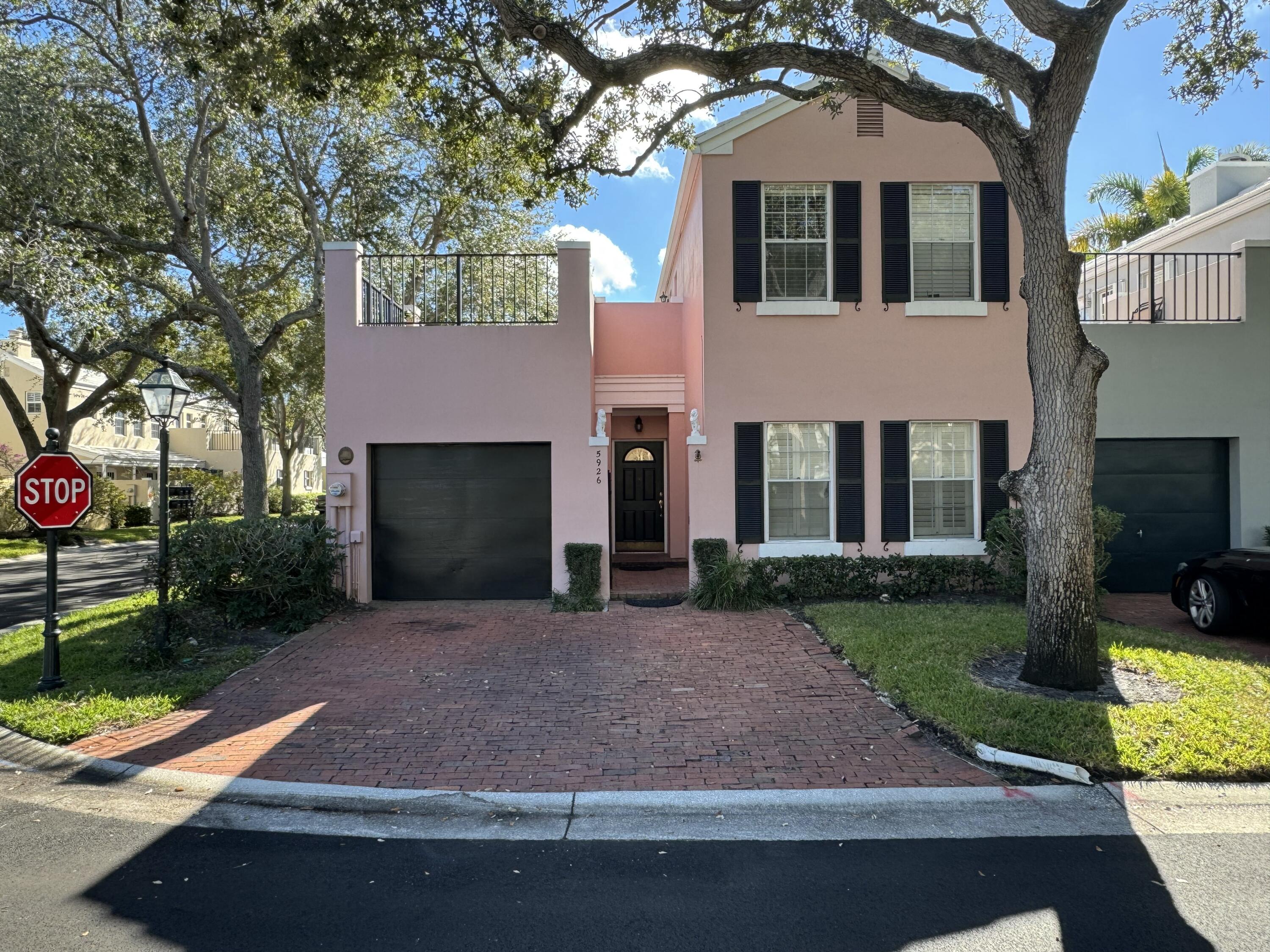 a front view of a house with yard