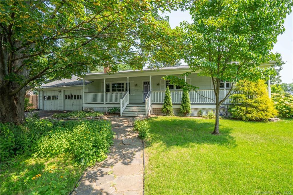 a view of an house with backyard space and garden