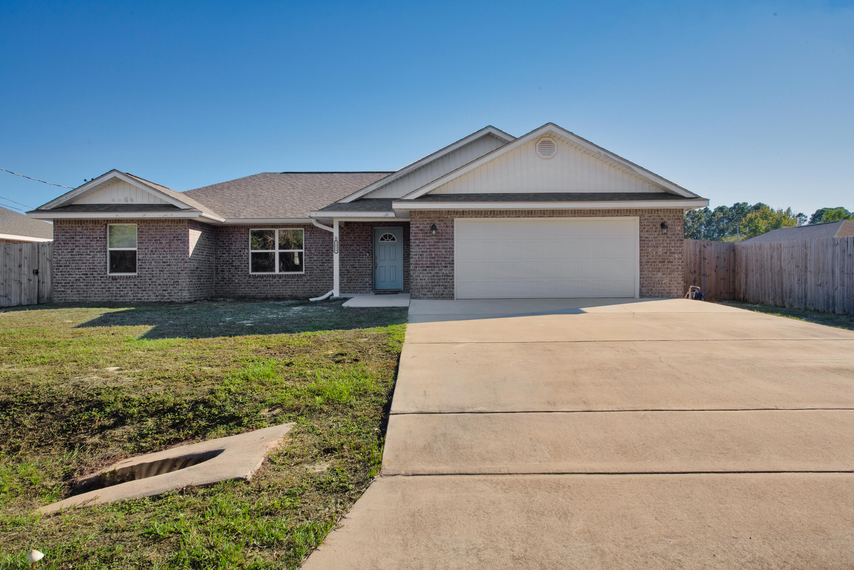 a front view of a house with yard