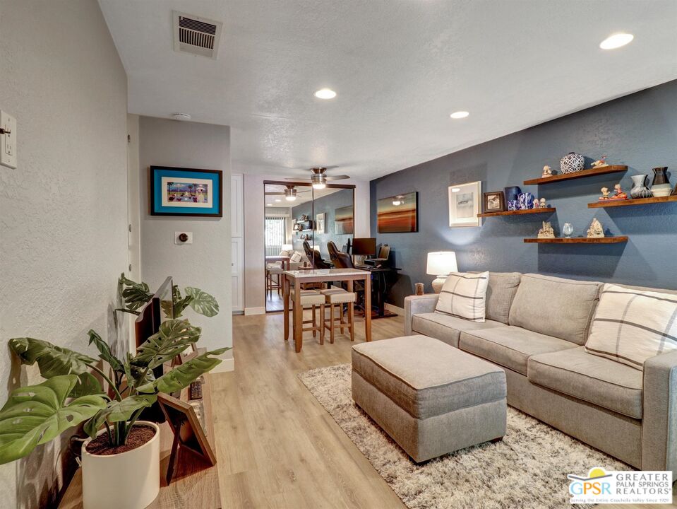 a living room with furniture and a couch