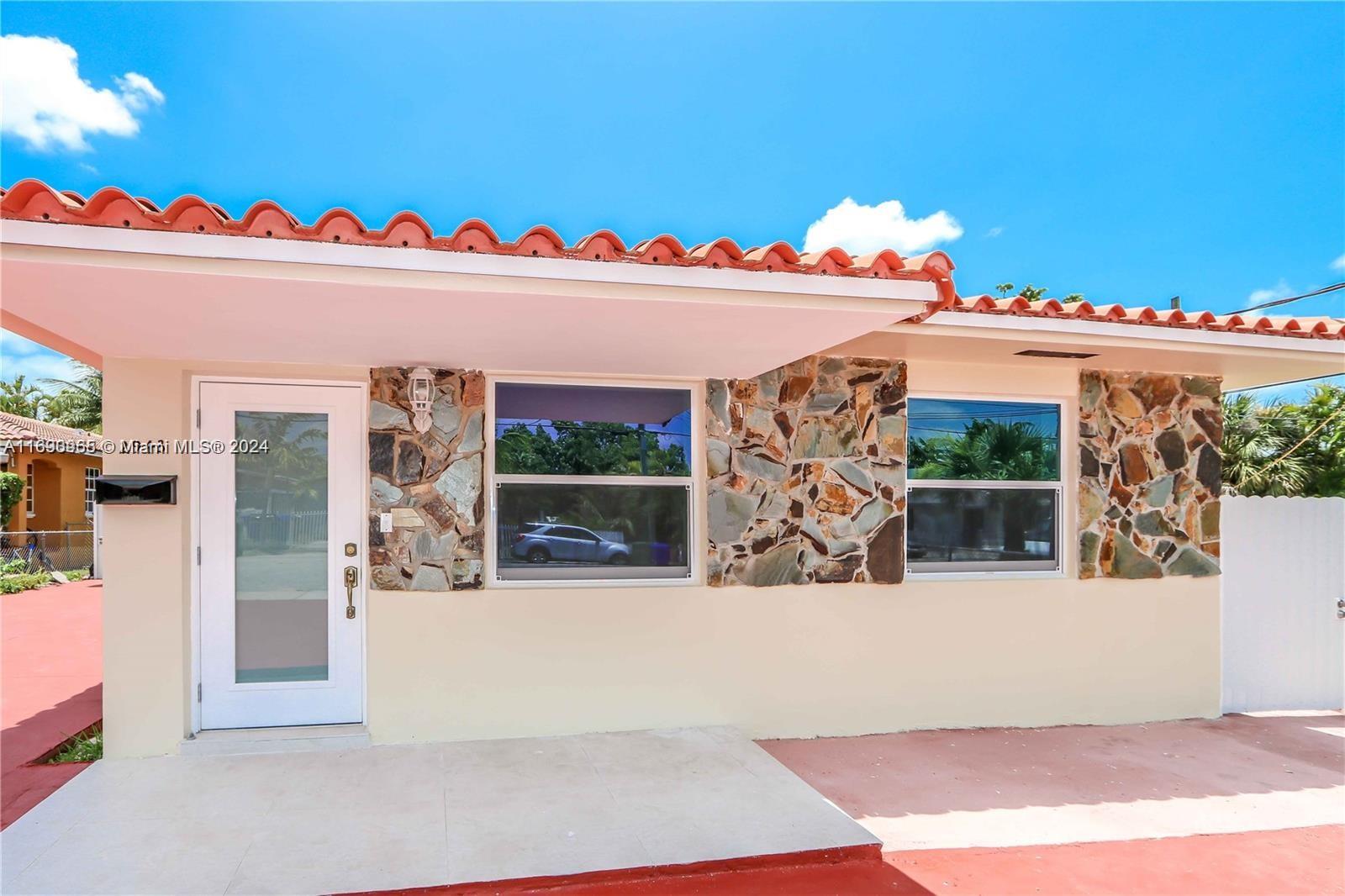 a front view of a house with a porch