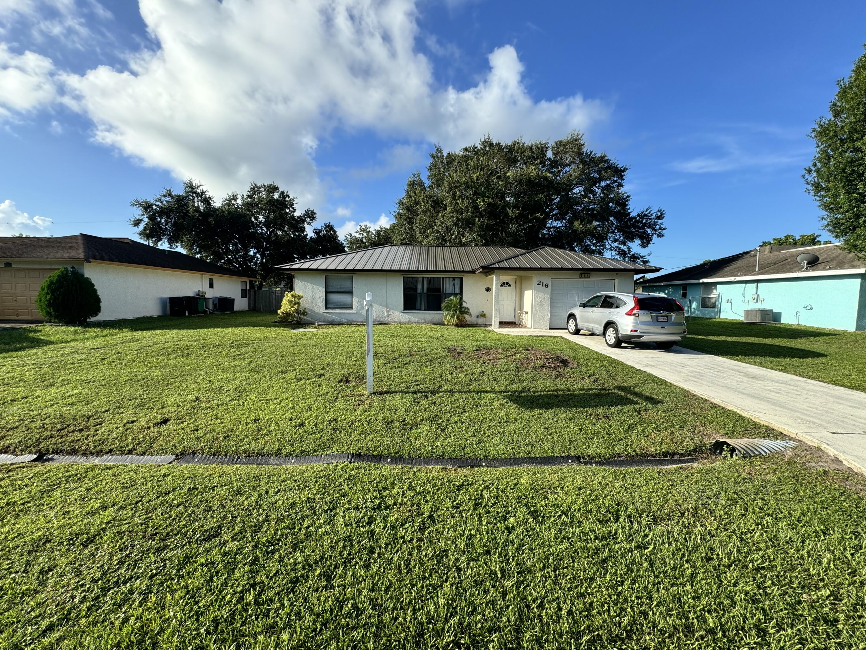 a view of a house with a big yard