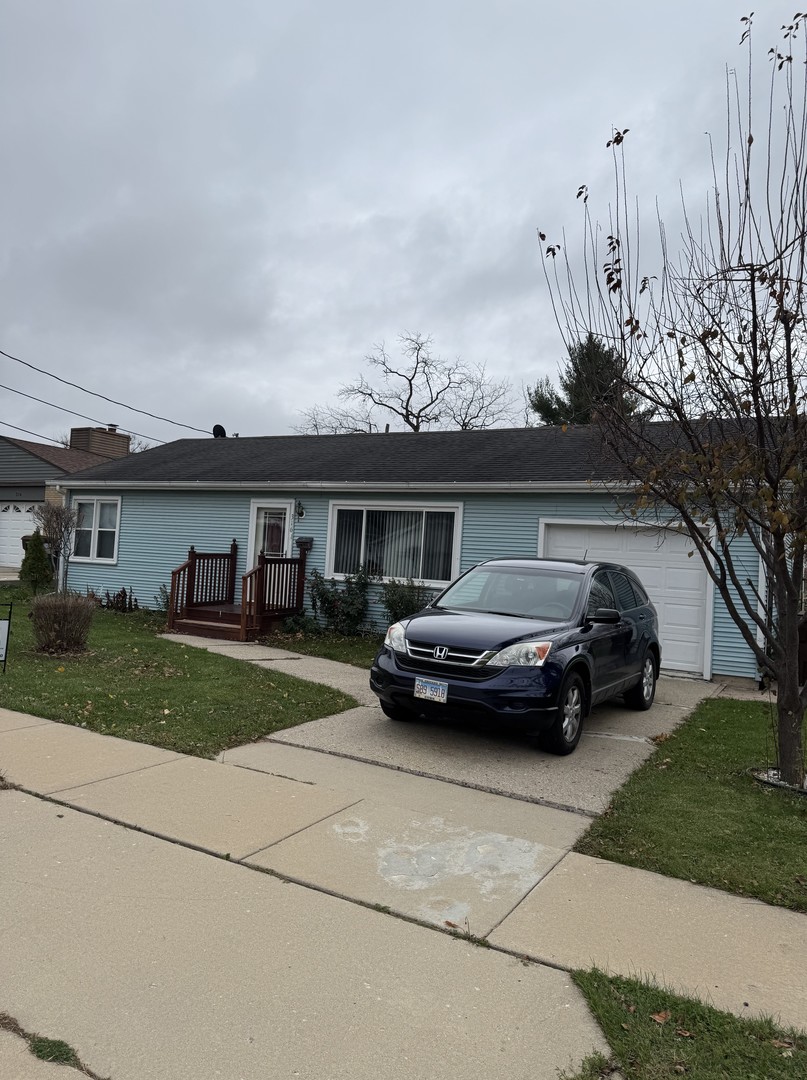 a view of a car parked in front of a house