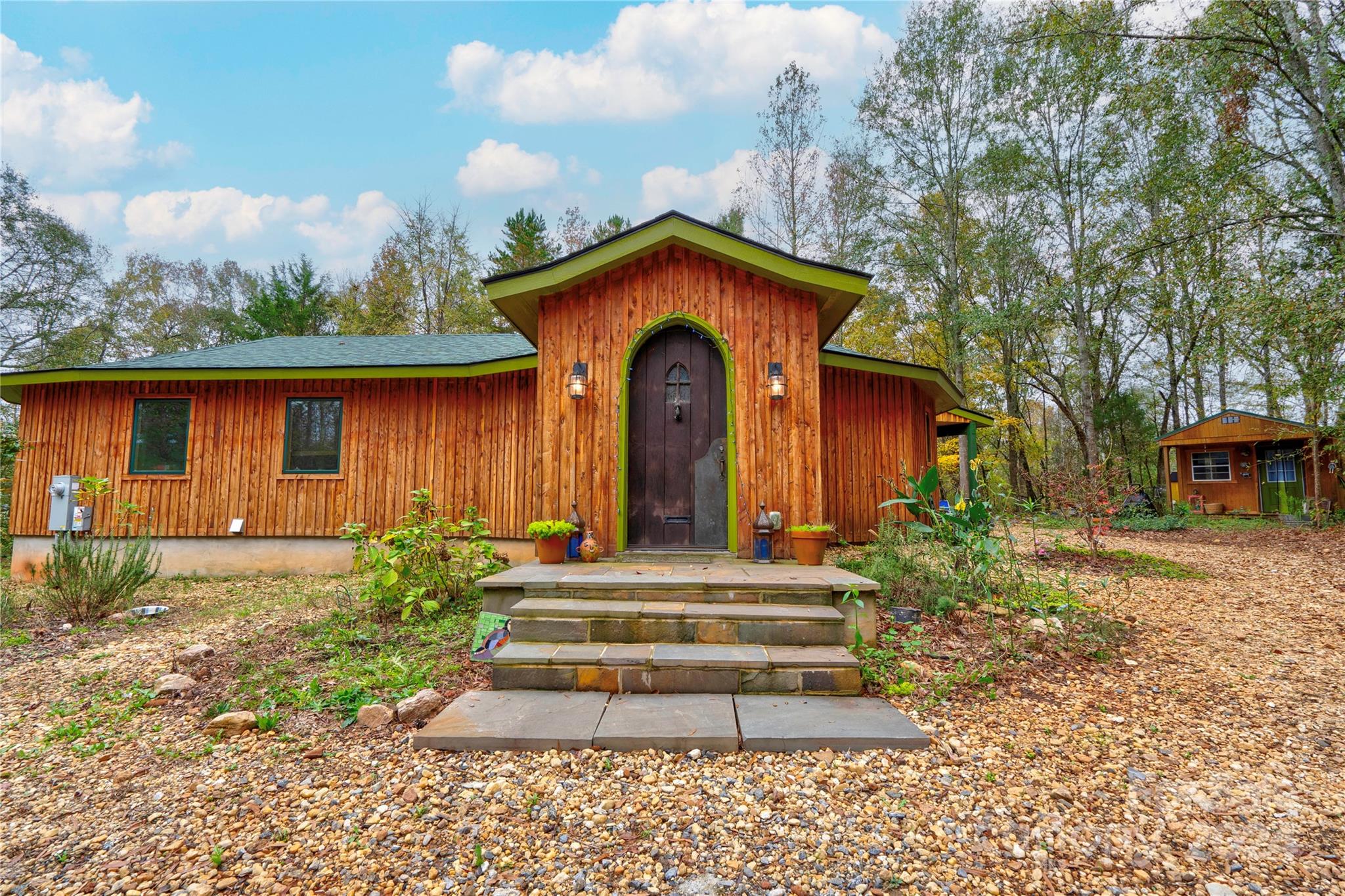 a front view of a house with garden