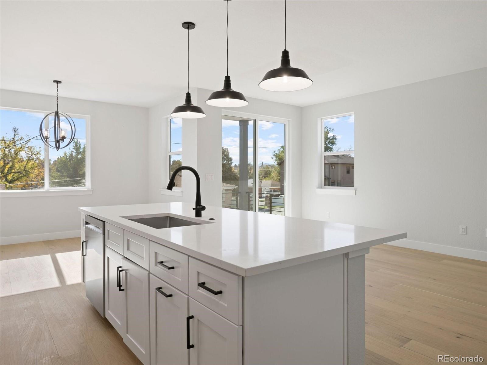 a kitchen with sink and window