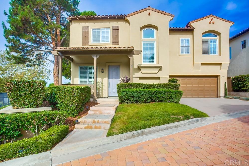 front view of a house with a yard