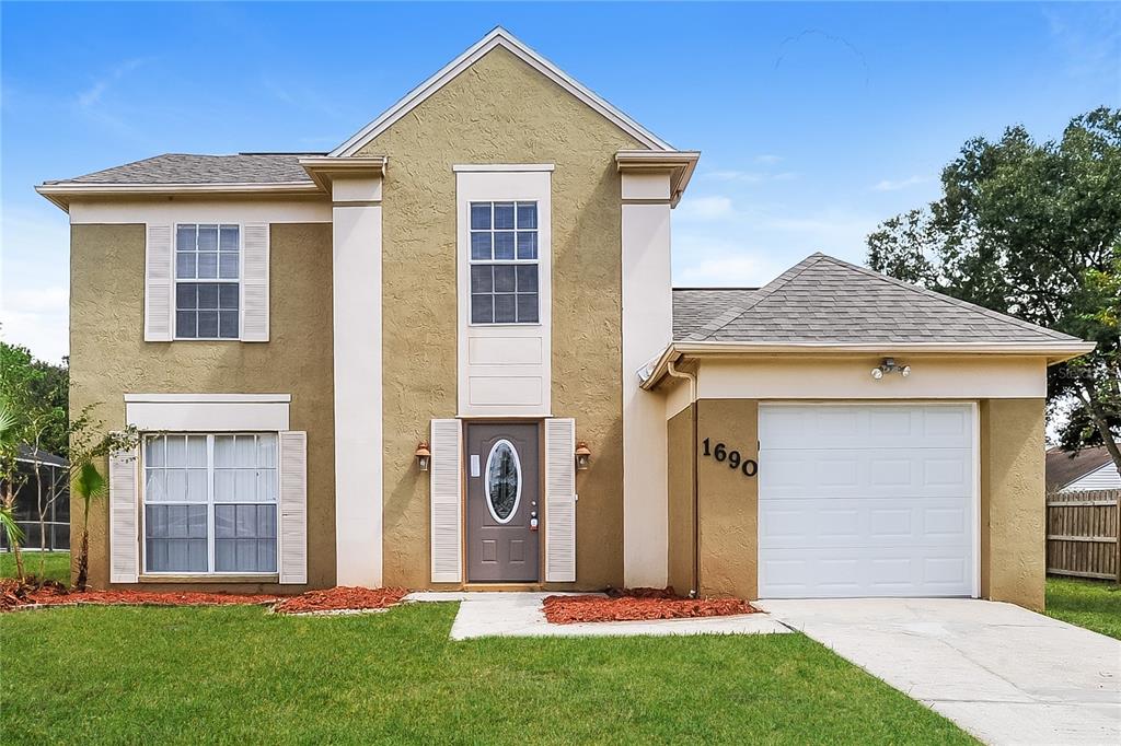 front view of a house with a yard