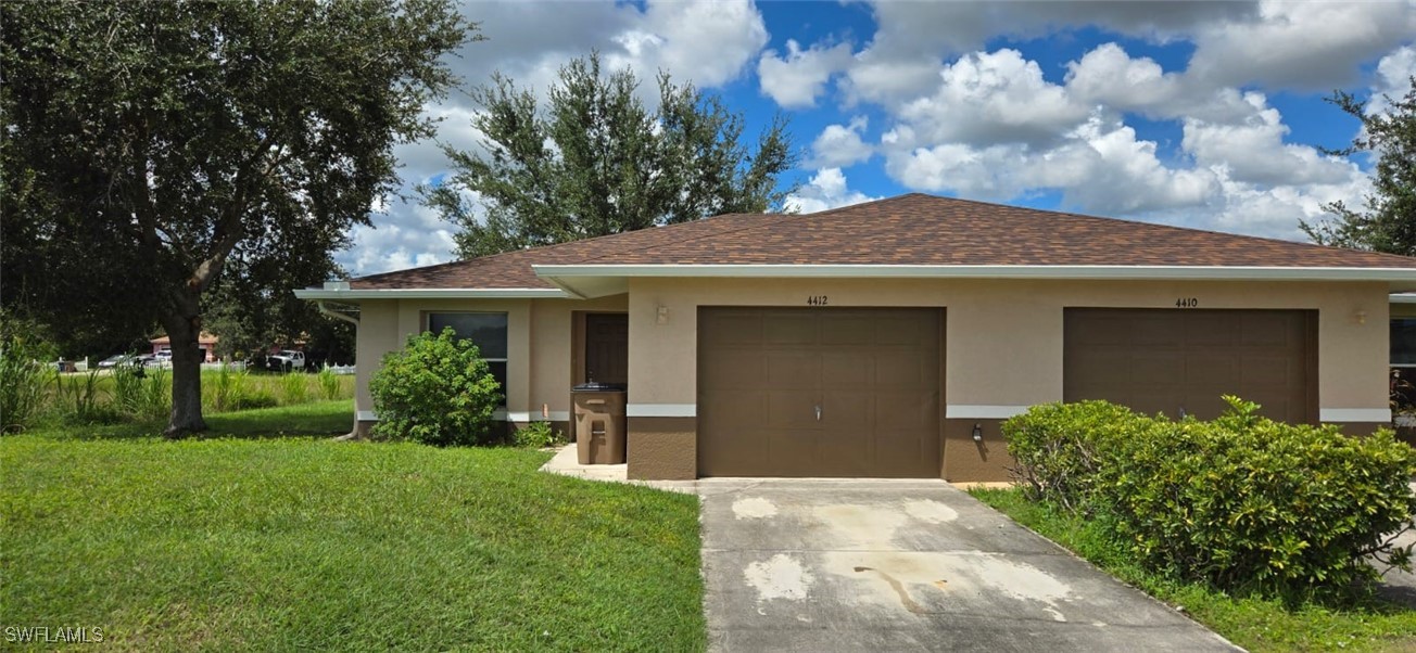 front view of a house with a yard