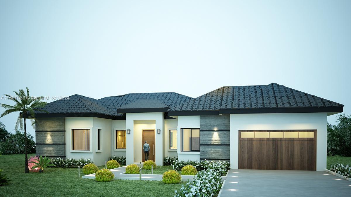 a front view of a house with garden