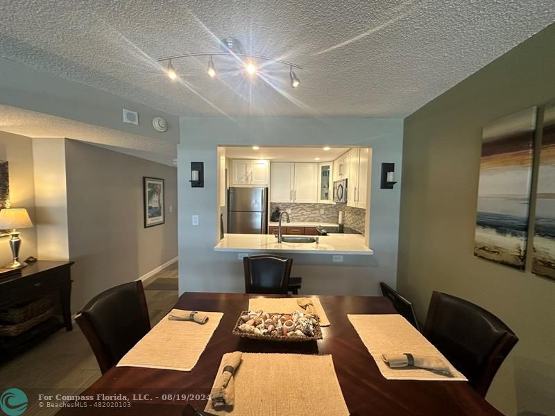 a view of a living room and dining room