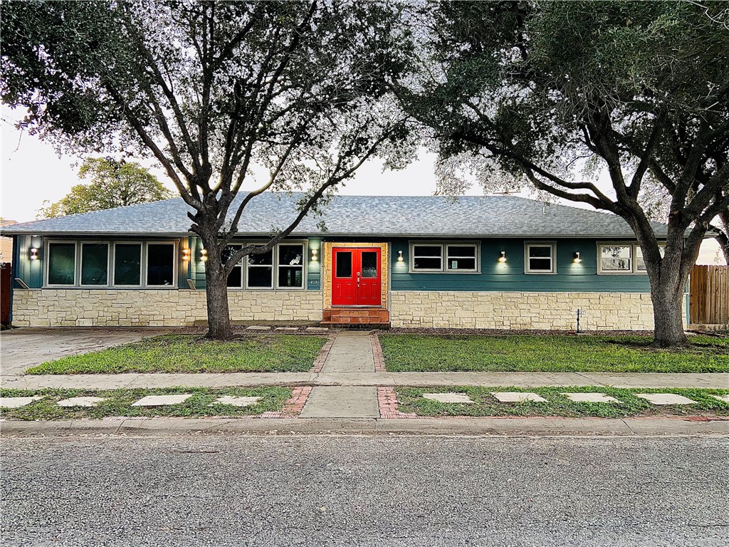 a front view of a house with a yard