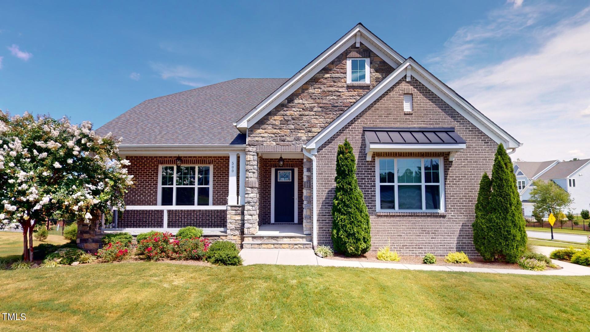 front view of a house with a yard