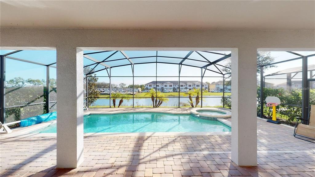 a view of a swimming pool with a porch