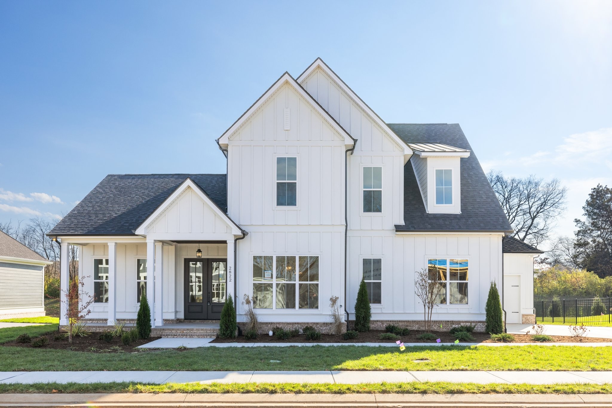 a front view of a house with a yard