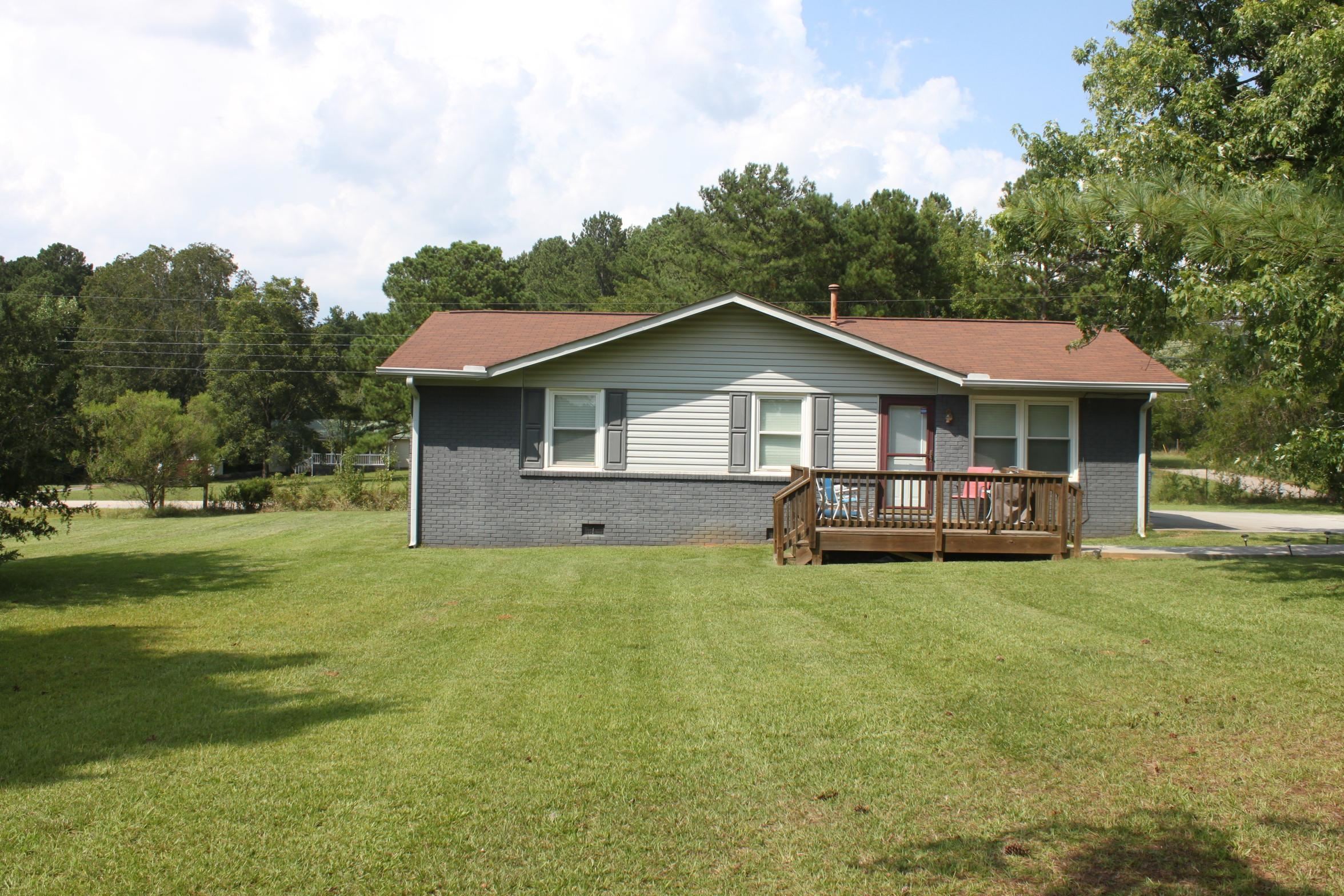 a front view of a house with garden