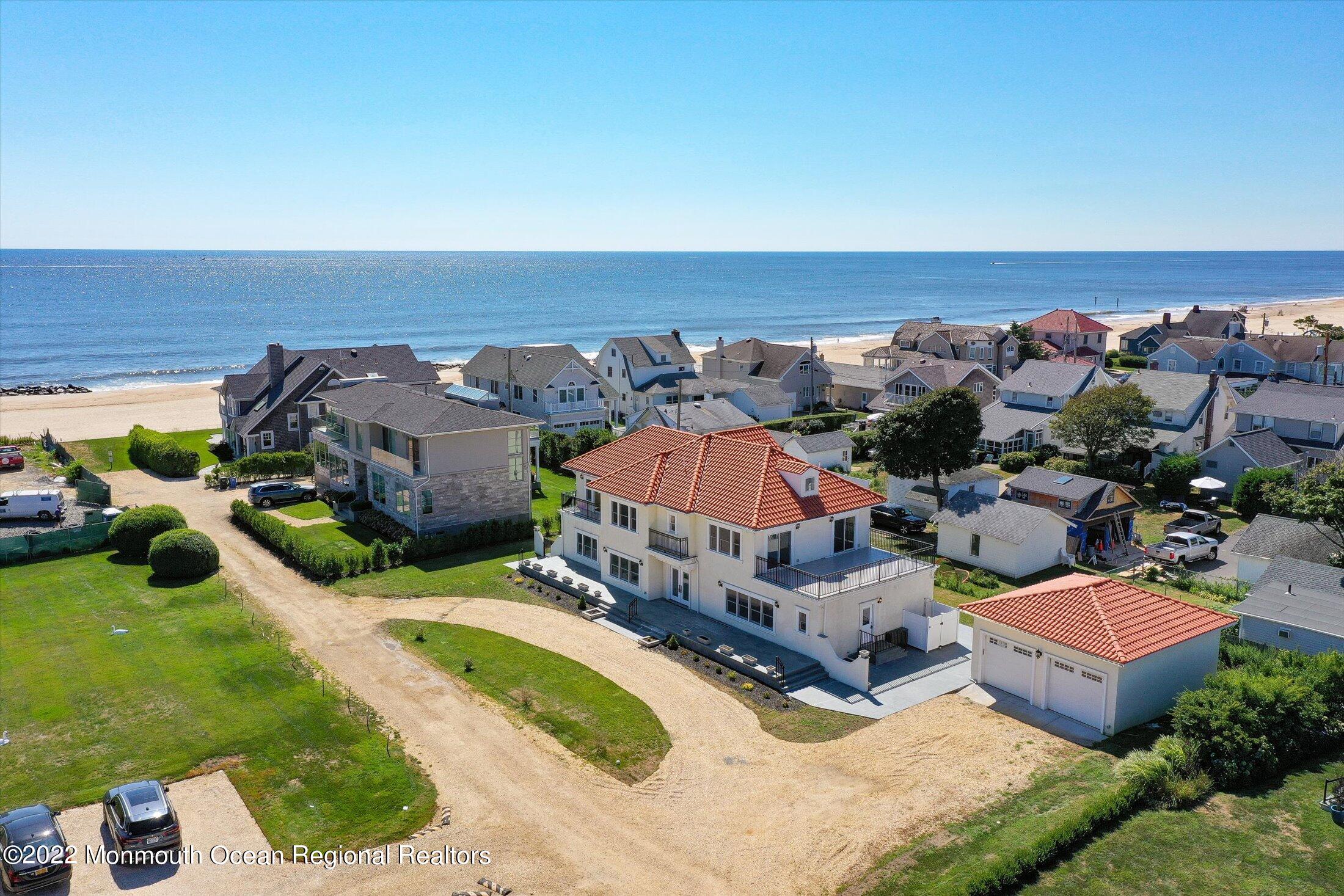 an aerial view of a house with yard and outdoor seating