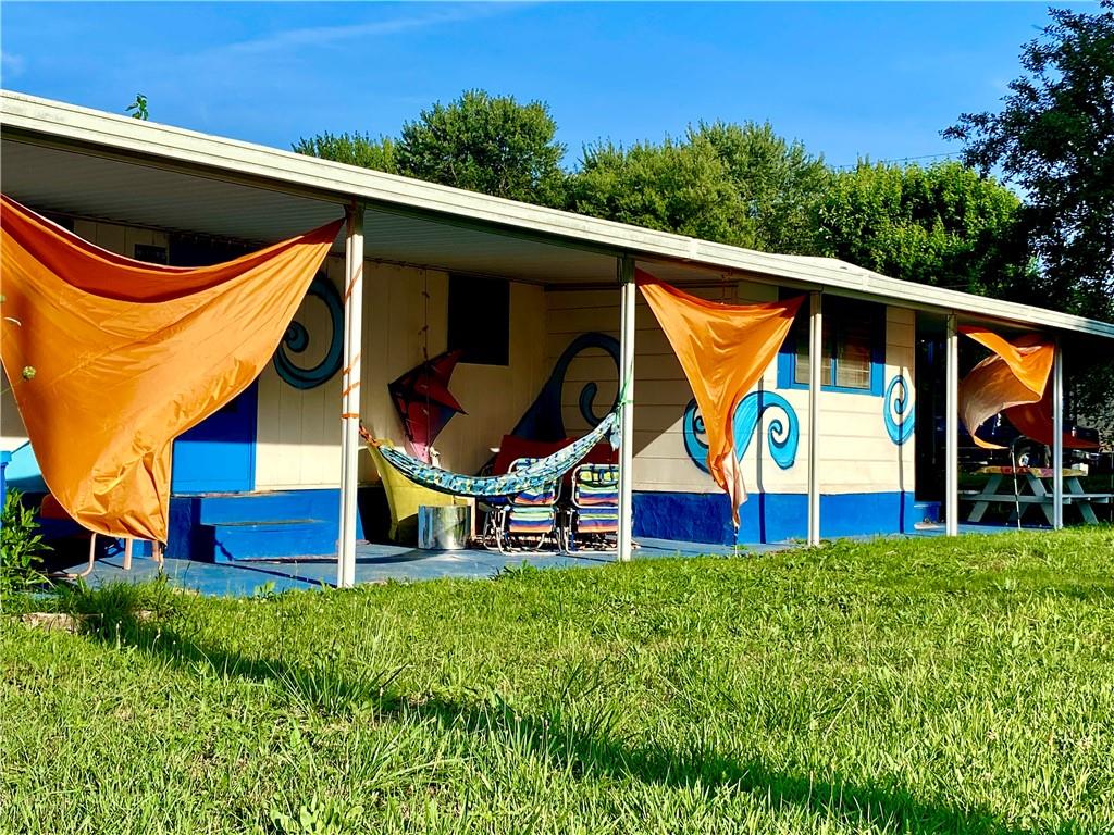 a view of swimming pool with a back yard