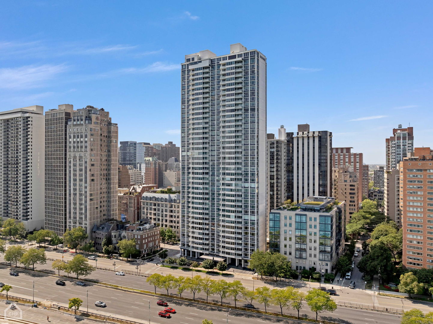 a front view of a residential apartment building with a yard