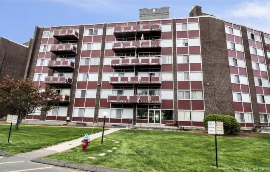 a view of a building with a yard