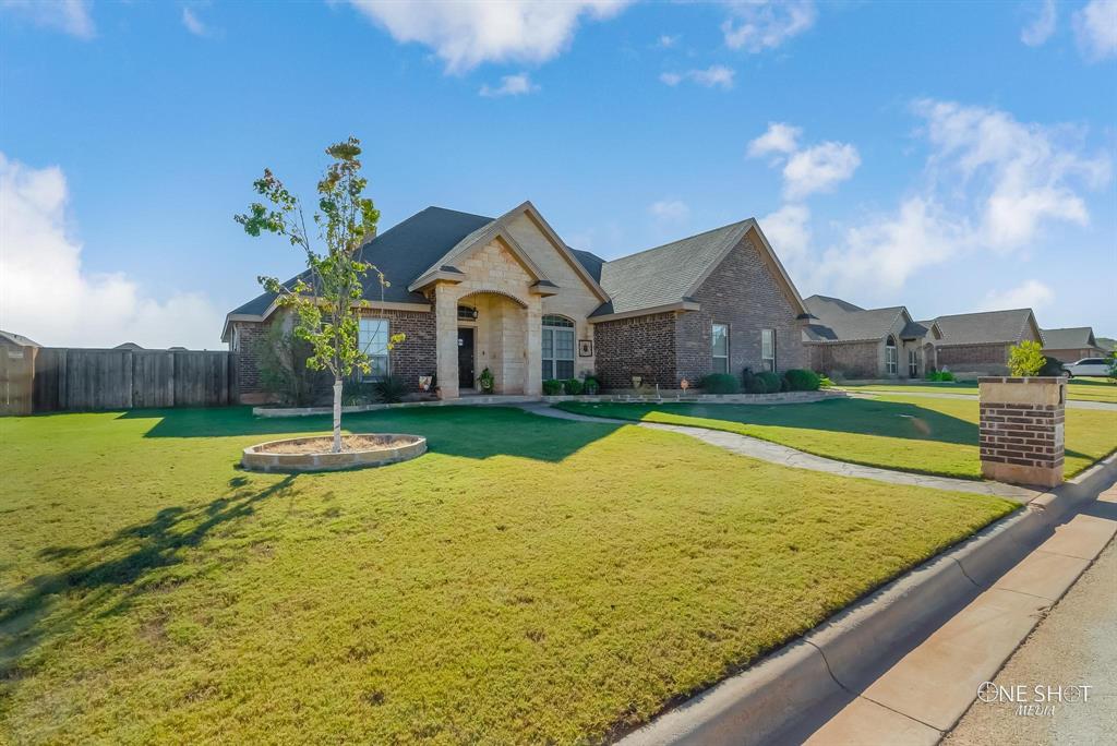 a view of an house with swimming pool yard and outdoor seating