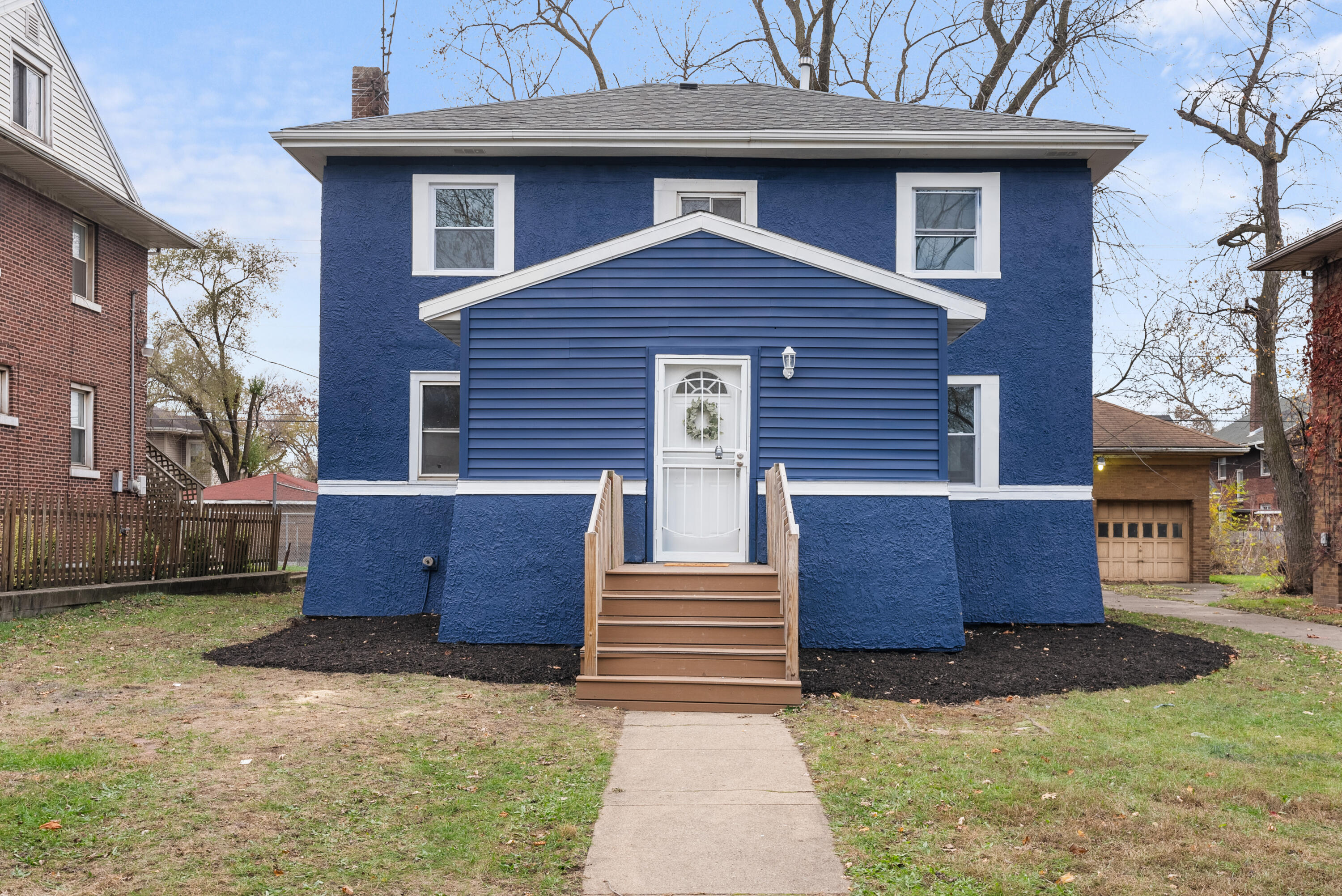 a front view of a house with a yard