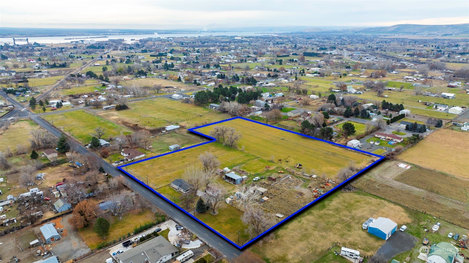 an aerial view of residential houses with outdoor space