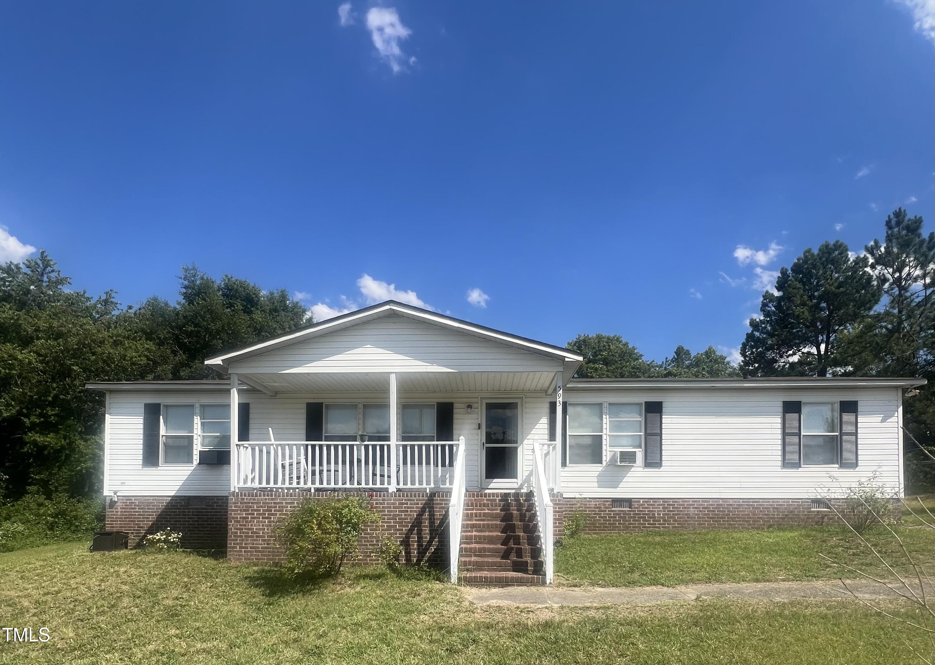 front view of a house and a yard