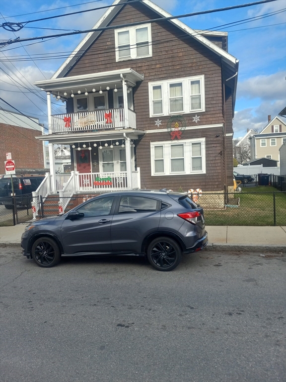 a car parked in front of a house