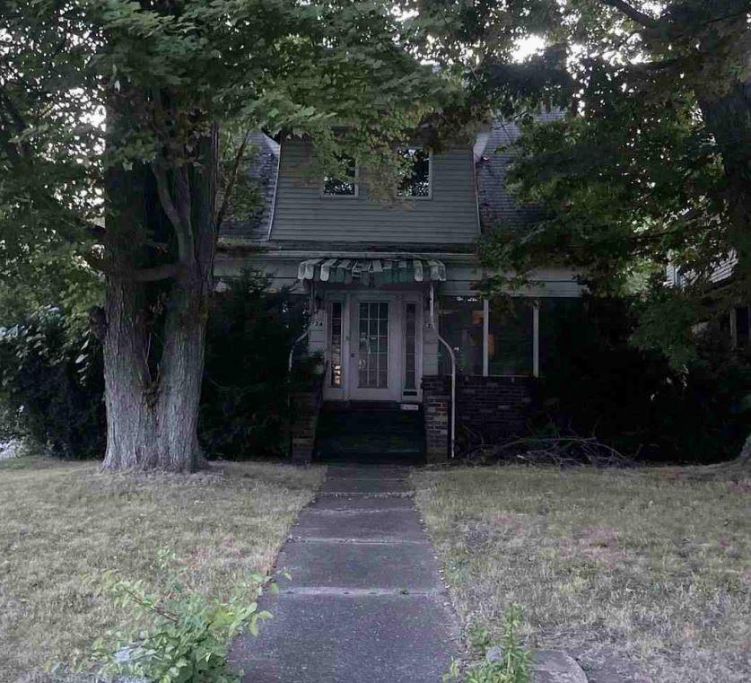 a front view of a house with a yard