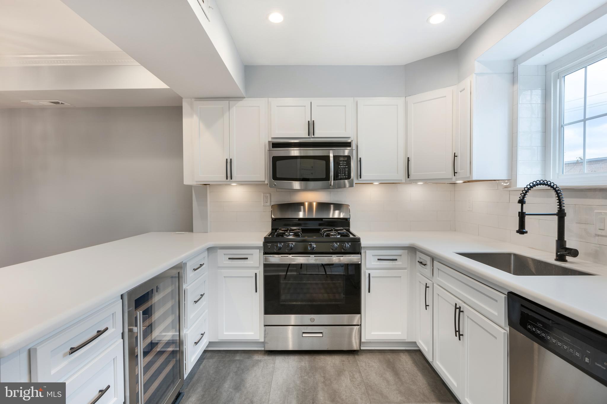 a kitchen with a stove and a sink