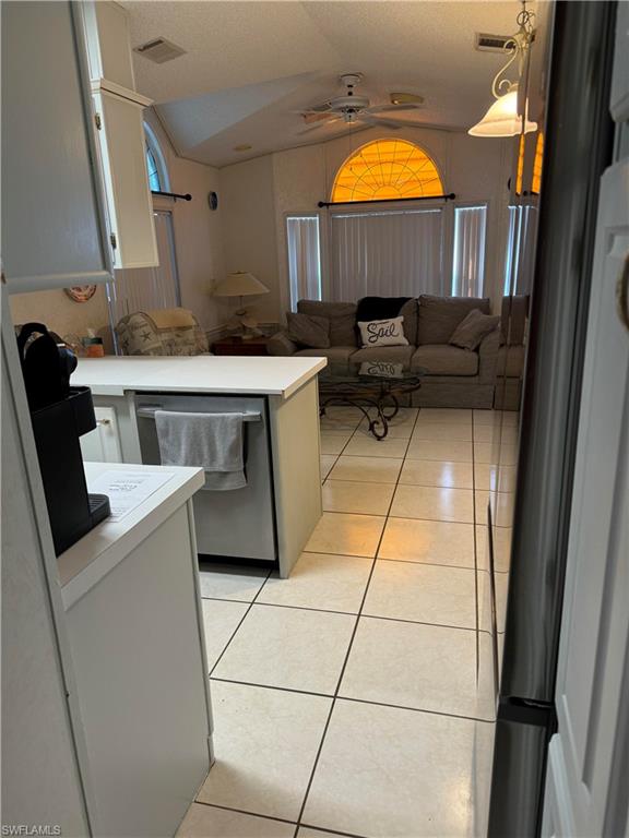 a kitchen with a sink and a mirror