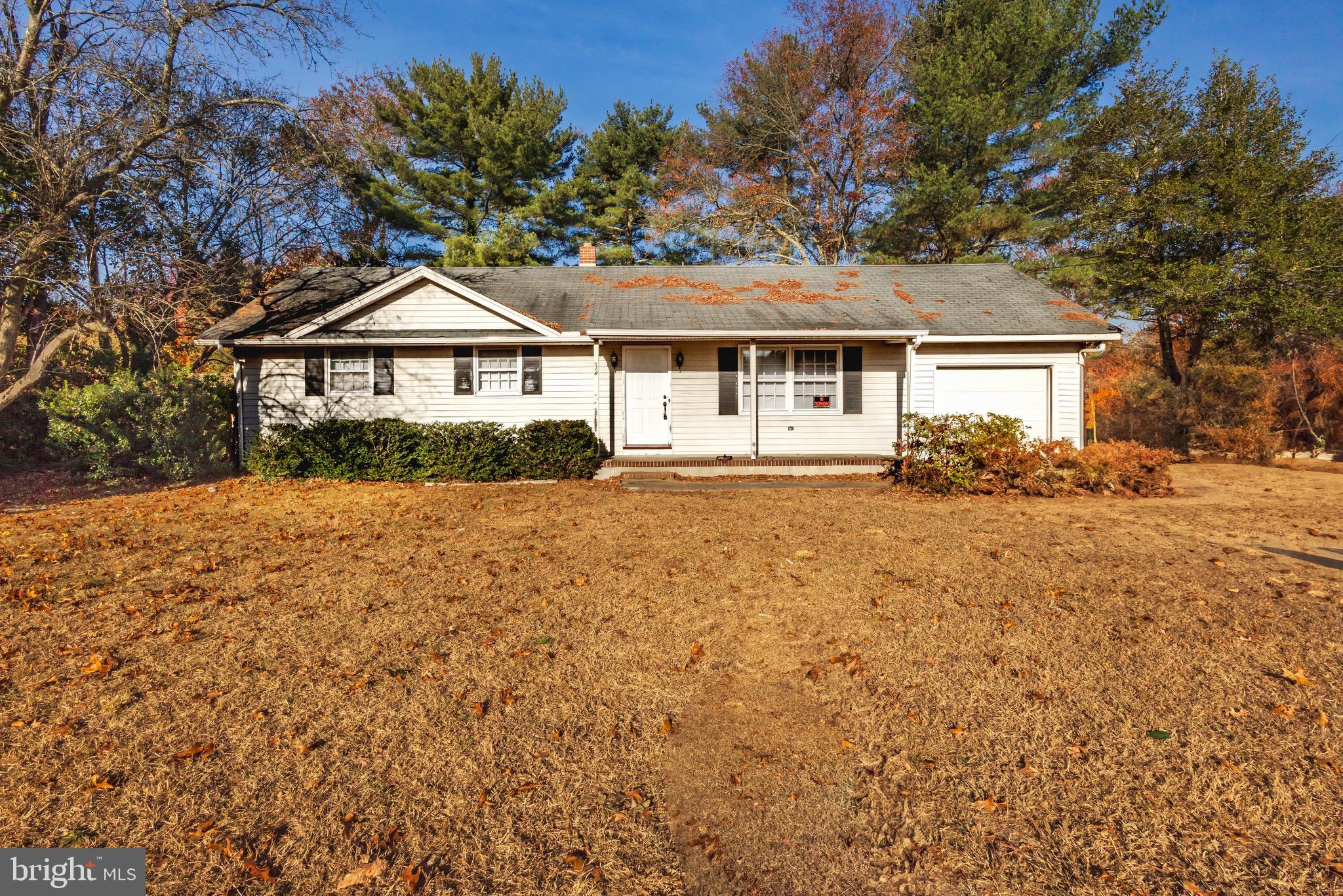 front view of a house with a yard