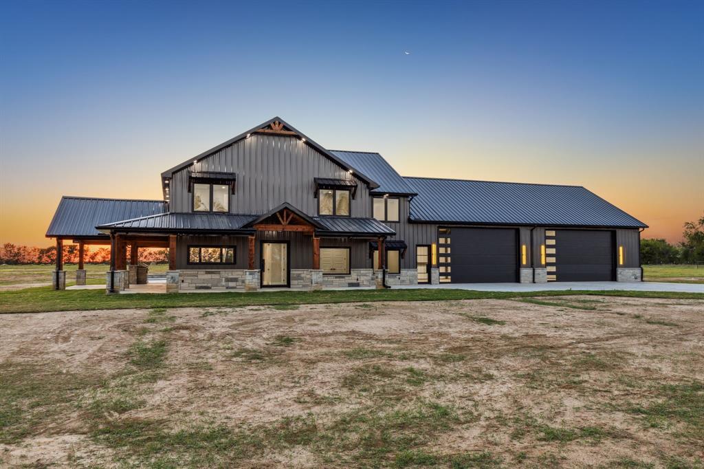 a big house with a big yard and more large trees