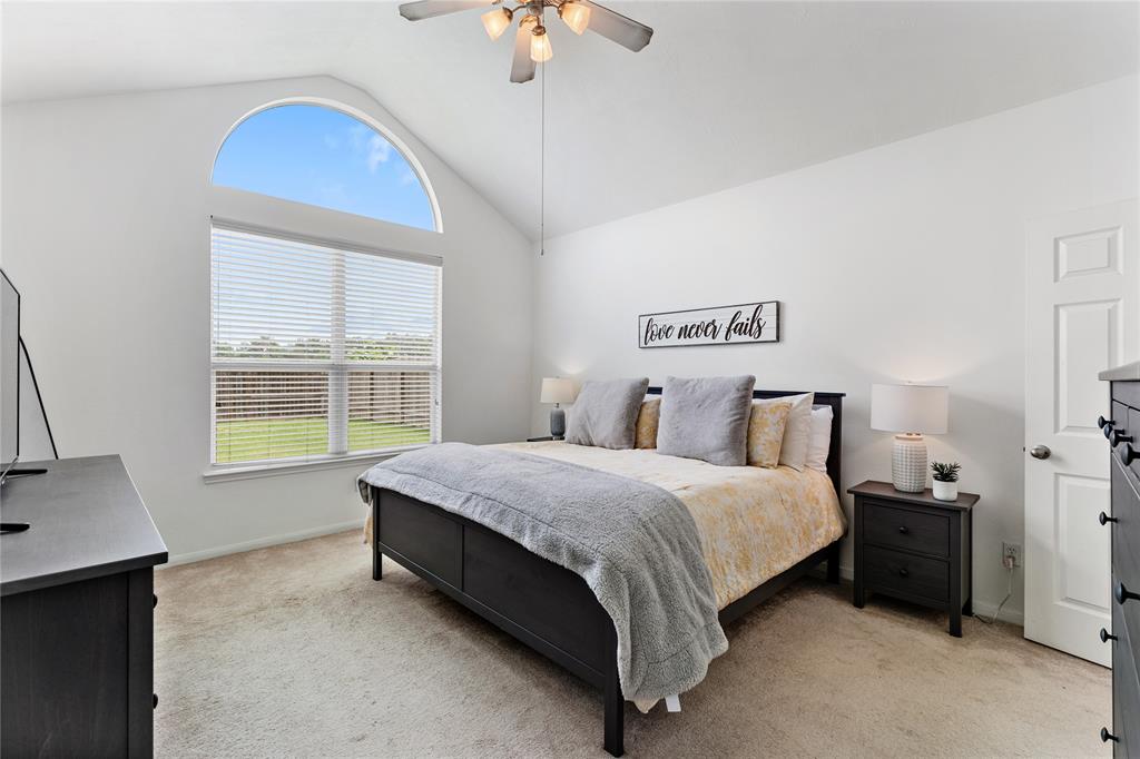 Located in the Masterplanned Community of Gleannloch Farms you have 4 bedrooms and 2.5 bathrooms! Primary bedroom features a vaulted ceiling with a large arched window, offering plenty of natural light with neutral paint tones.