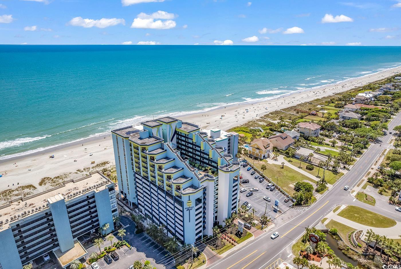 Drone / aerial view with a beach view and a water